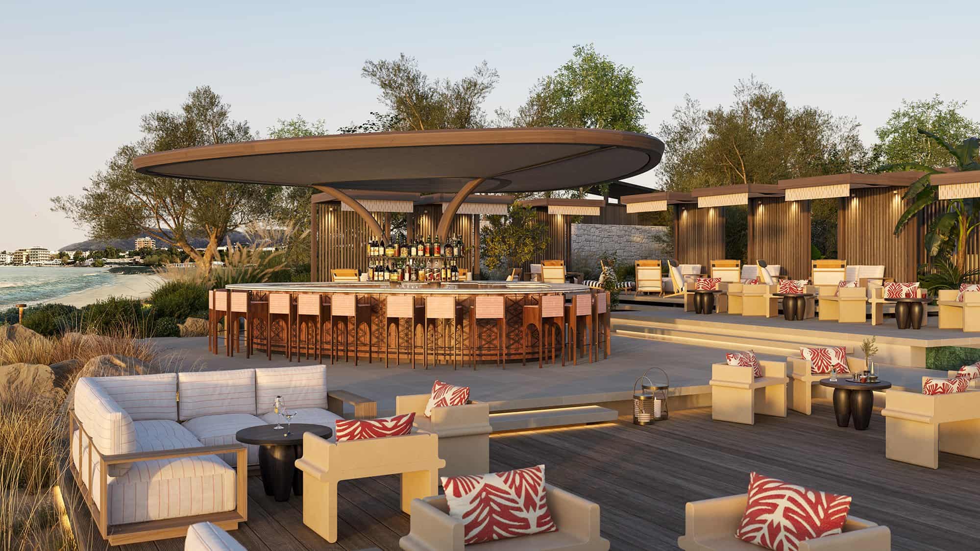 Outdoor bar and lounge area with cushioned seating and a circular bar under a shaded canopy.