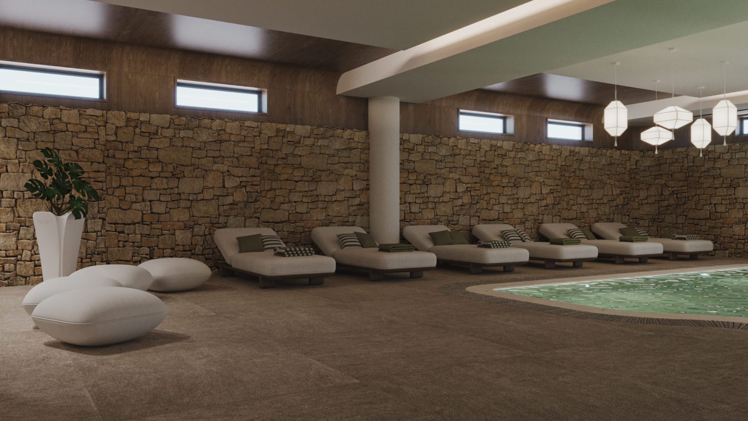 Modern spa lounge with cushioned recliners and stone walls.