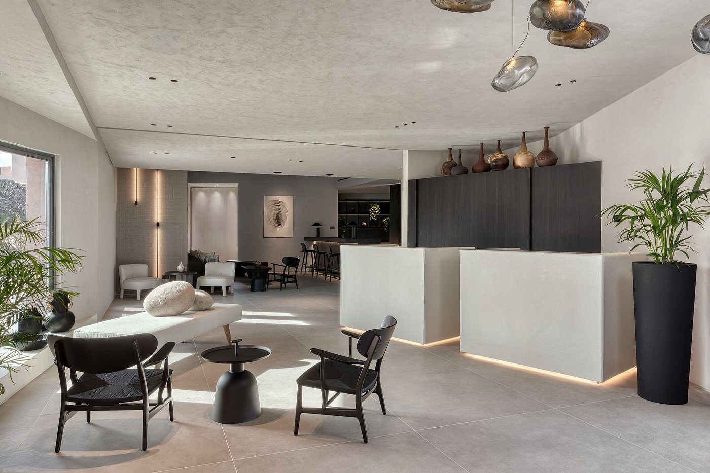 Minimalist cafe interior with modern furniture and neutral tones.