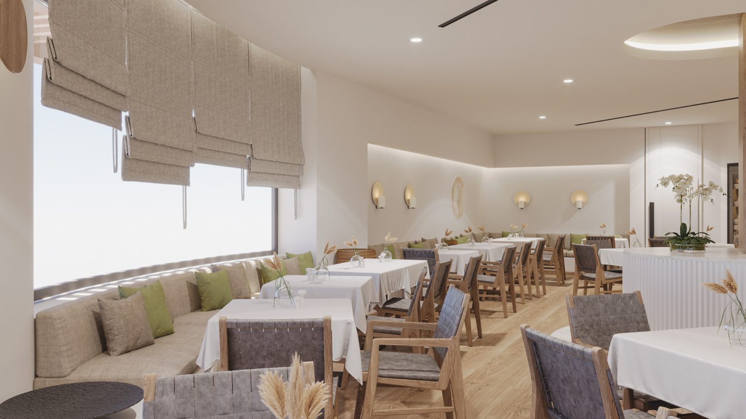 Elegant dining area with white tablecloths and wooden chairs.