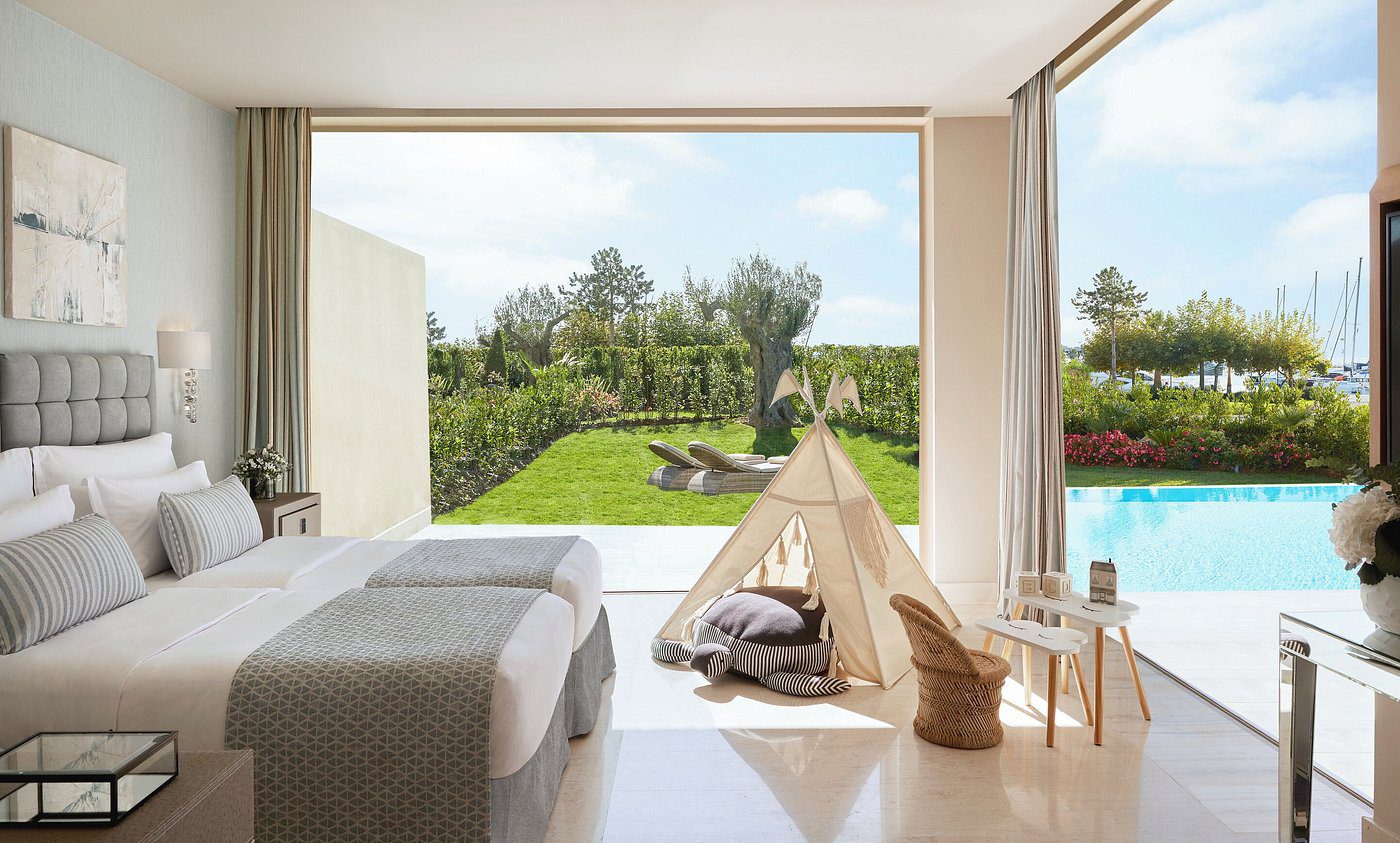 Bright room with cozy teepee and garden view.