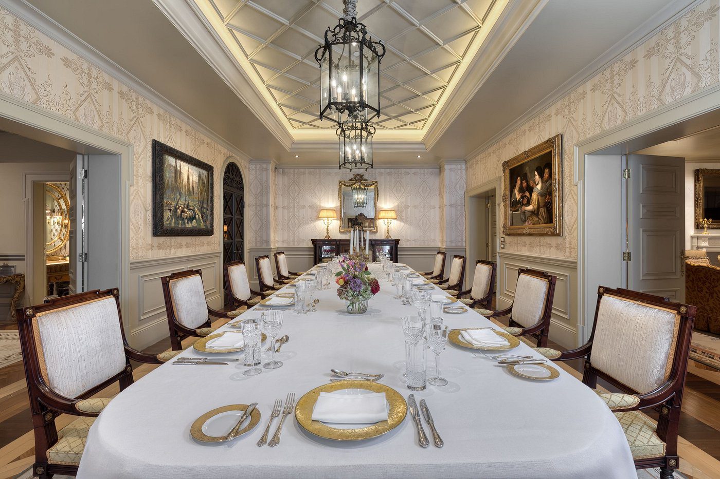 Elegant dining room with a long table set for a formal dinner.