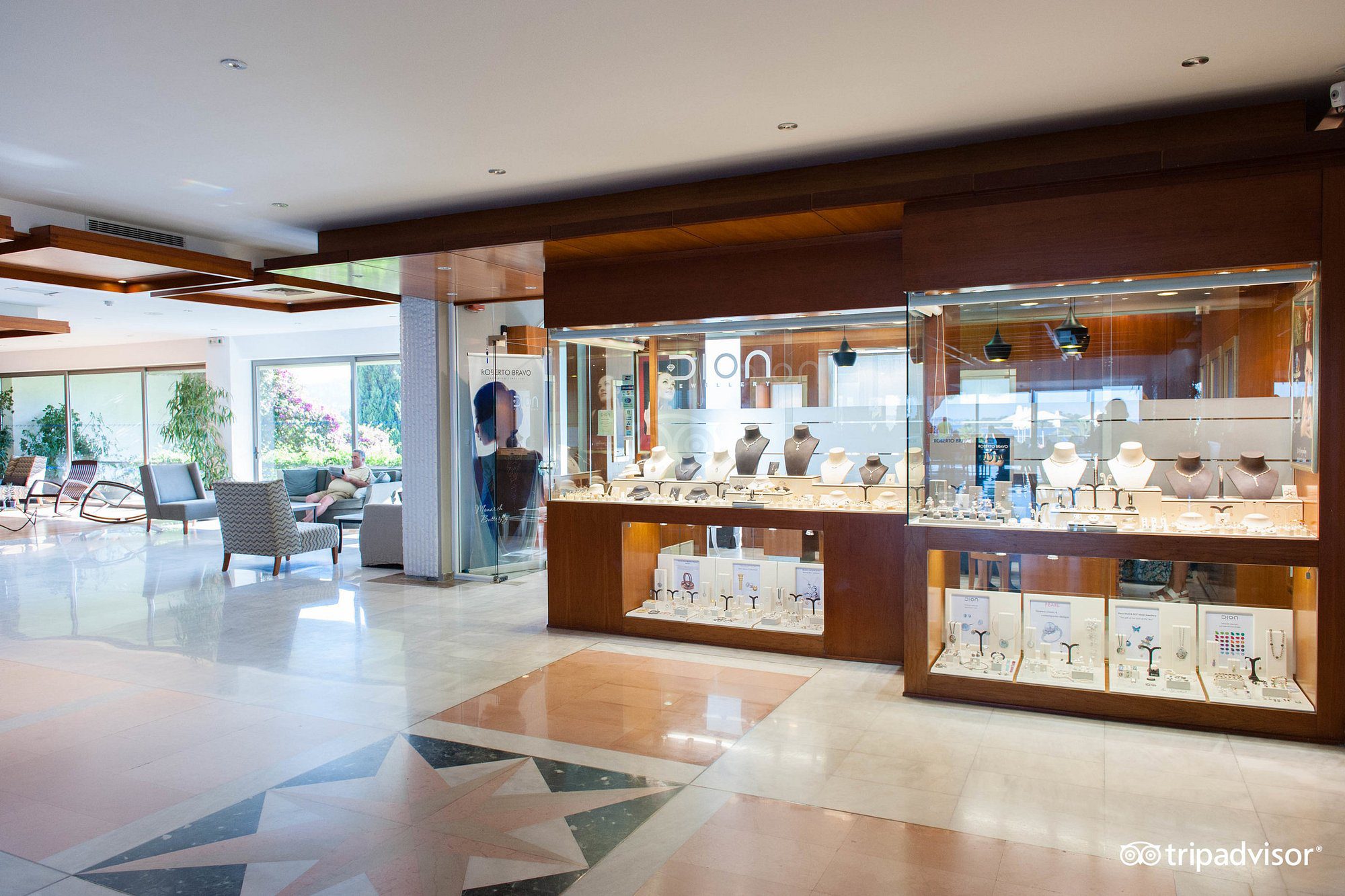 Elegant jewelry display in a bright, modern store interior.