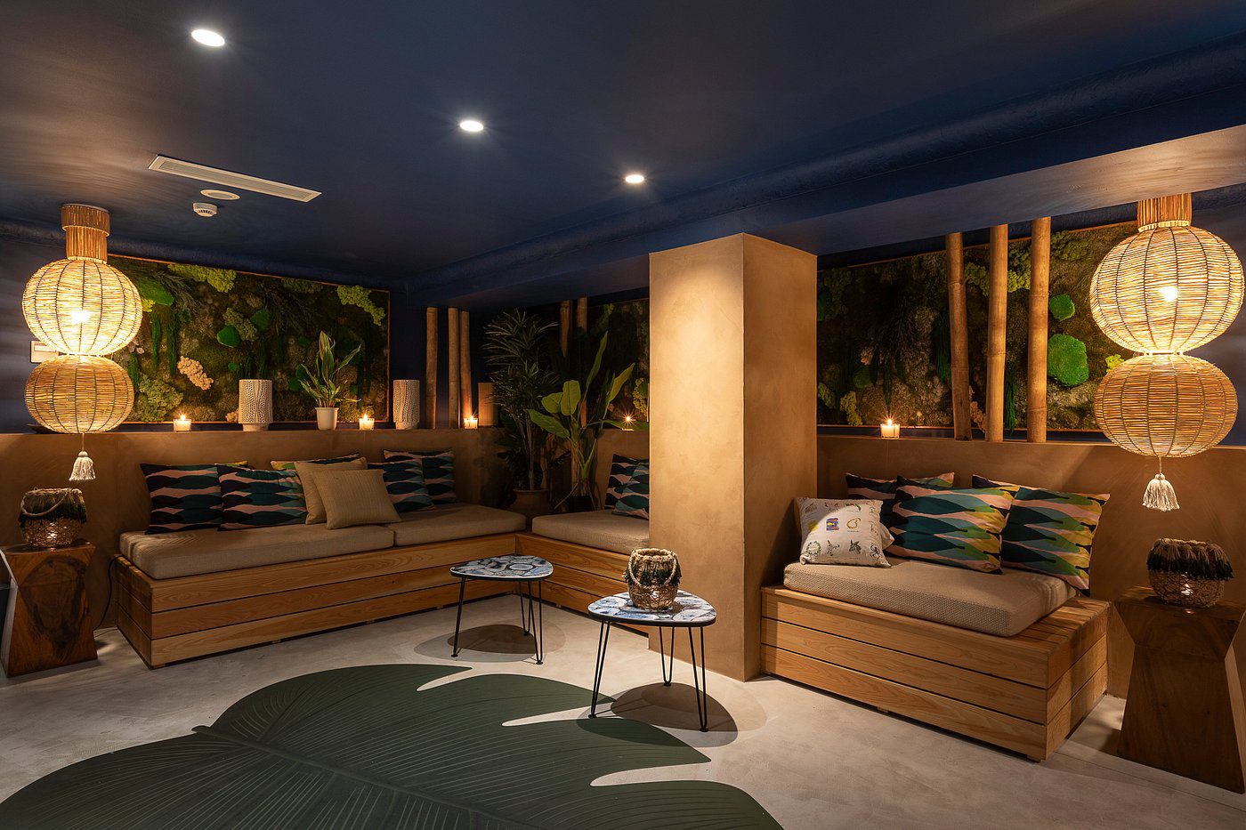 Cozy outdoor seating area with warm lighting and modern decor.