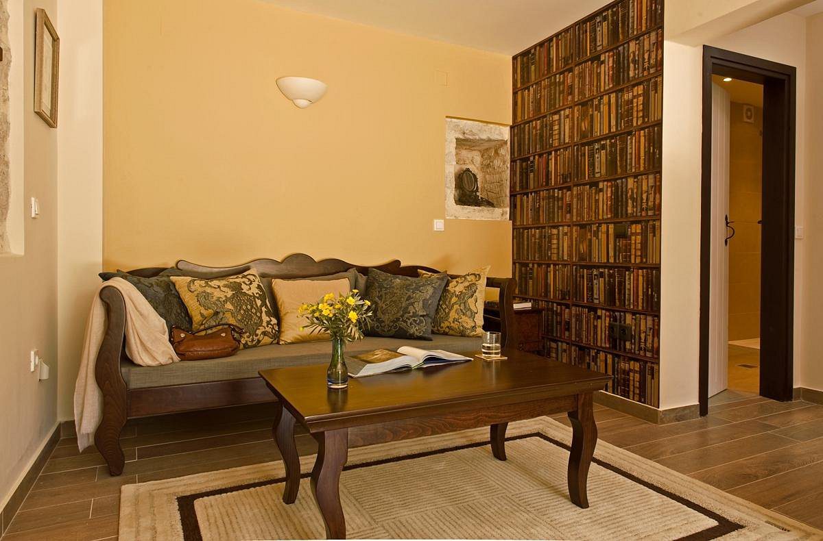 Cozy living room with elegant sofa and wooden coffee table.