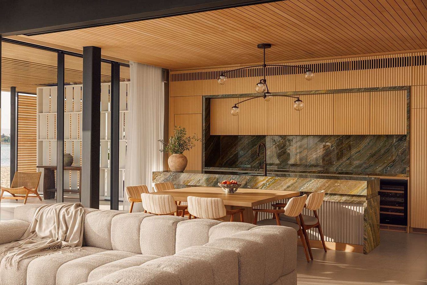 Modern living room and dining area with wooden ceiling and neutral tones.