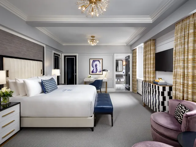 Modern bedroom with neutral tones and elegant decor.