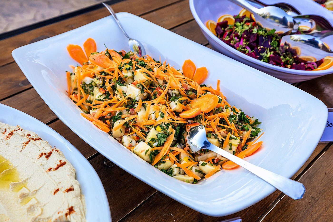 A vibrant shrimp salad with cilantro and orange slices.